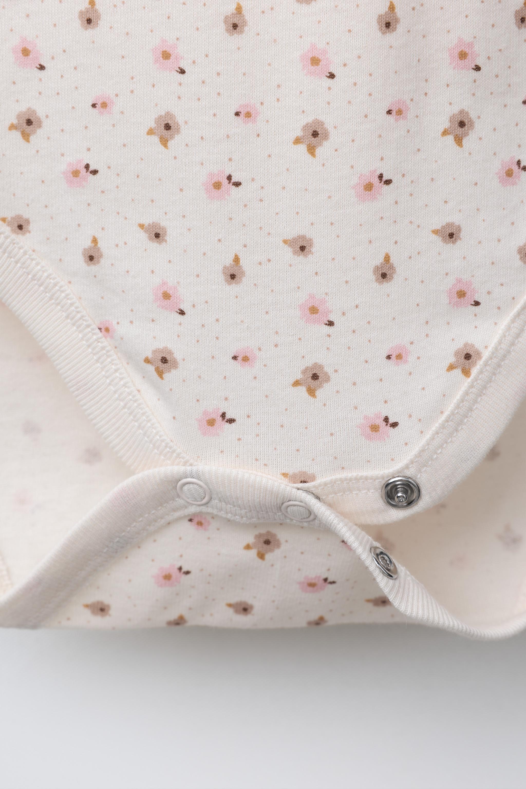 FIVE-PACK OF FLORAL BODYSUITS